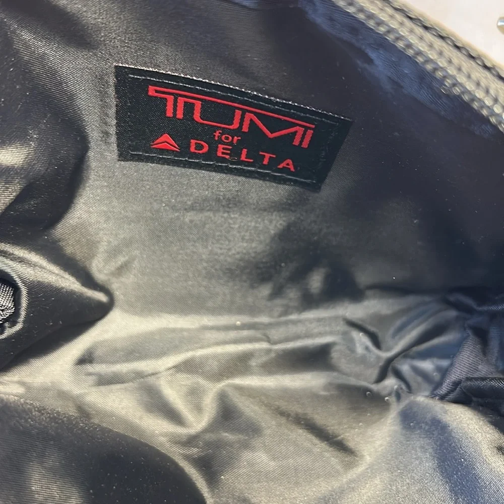 TUMI new never used cosmetic bag with some goodies